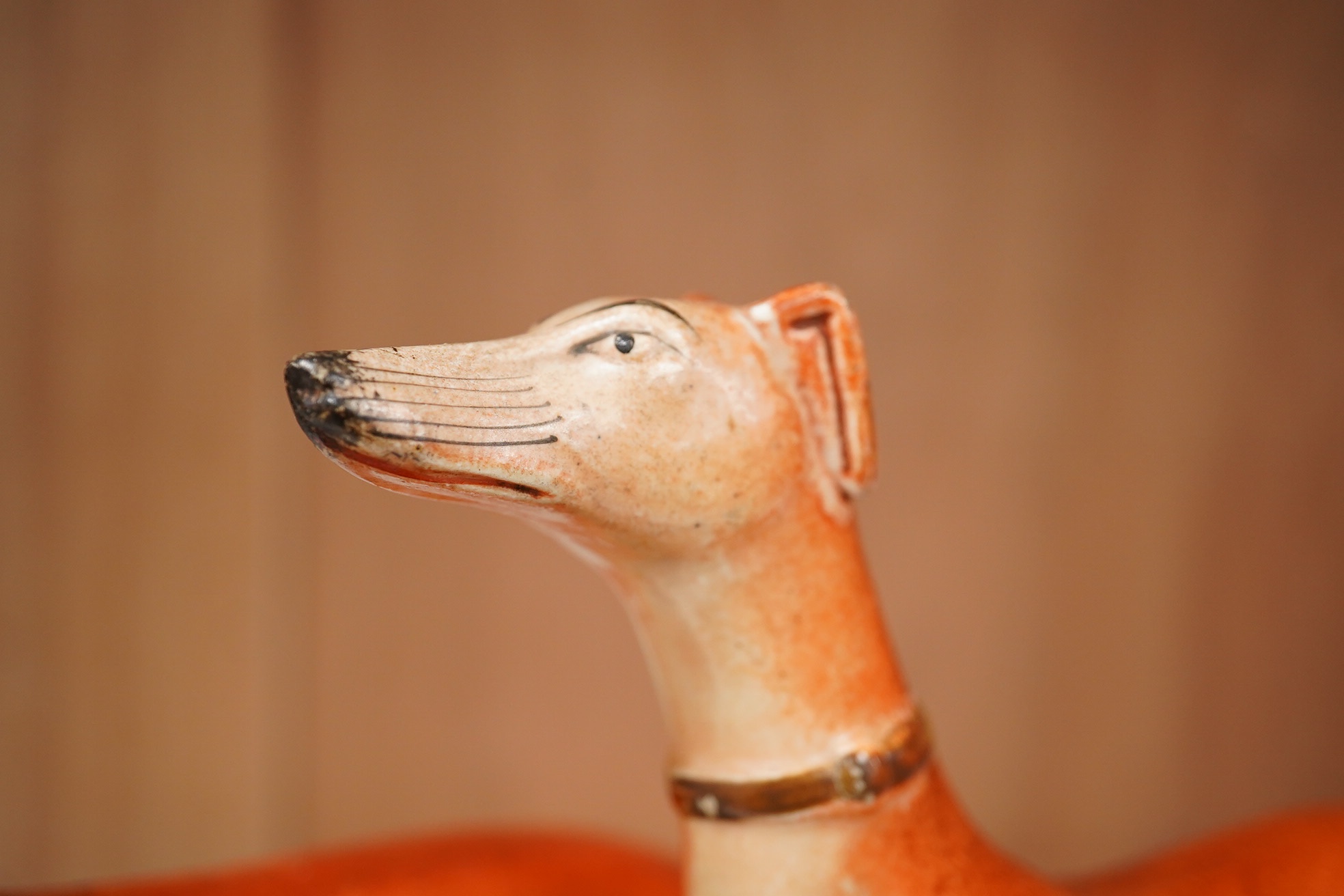 Three graduated Staffordshire pottery greyhounds and two others, longest 19cm (5). Condition - restored